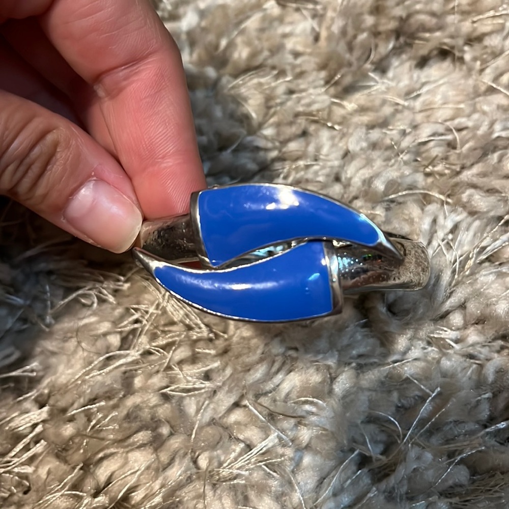 Silver and blue curved arrow bracelet